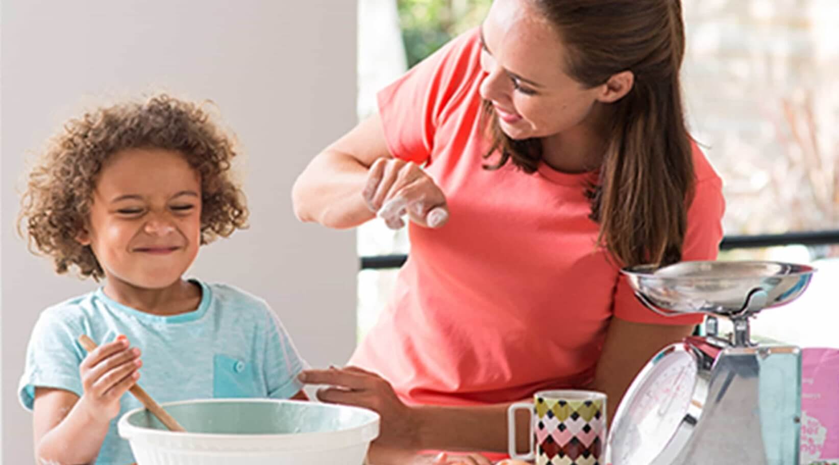 Mother and child baking enjoying comfortable air quality in smart home