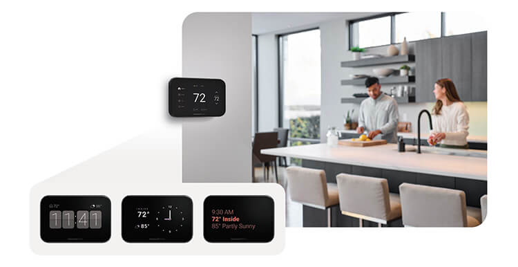 A couple is cooking in the kitchen with Smart Thermostat idle screens in the foreground. 