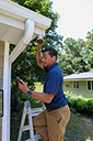 Dealer, A installer is installing the Resideo Outdoor Camera 