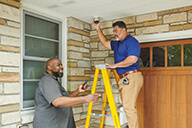 Homeowner, a installer is helping the homeowner installing the  Pro VX3 camera lo res.