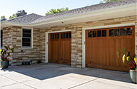 A house with the outdoor camera installed in front of the parking garage.